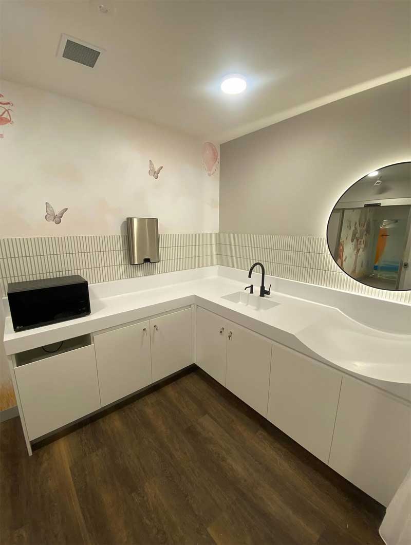 White bench and finger tile splashback with butterfly wall decals